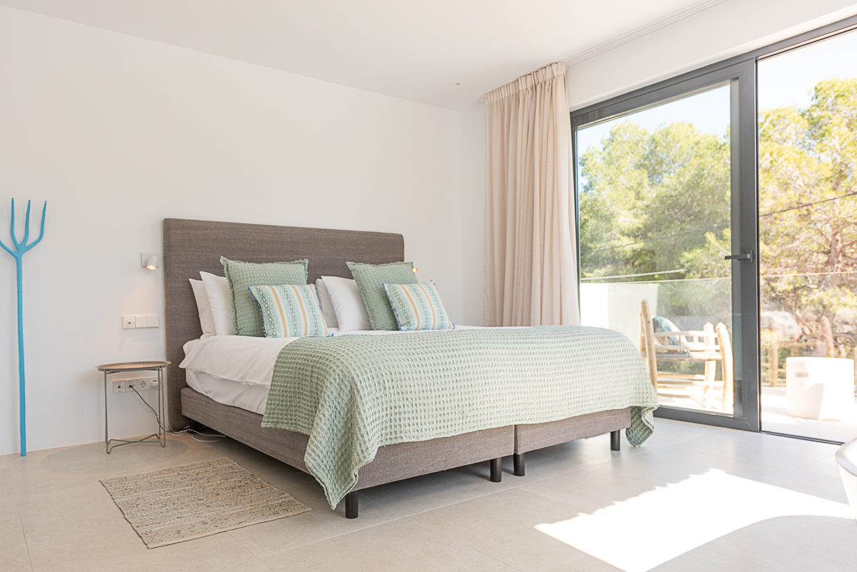 Resa estate modern villa for sale ibiza first line north bedroom green.jpg